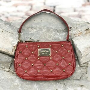 Michael Kors gold tone studded red quilted leather wristlet clutch